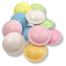 photo of small pile of multicoloured flying-saucer-shaped sweets